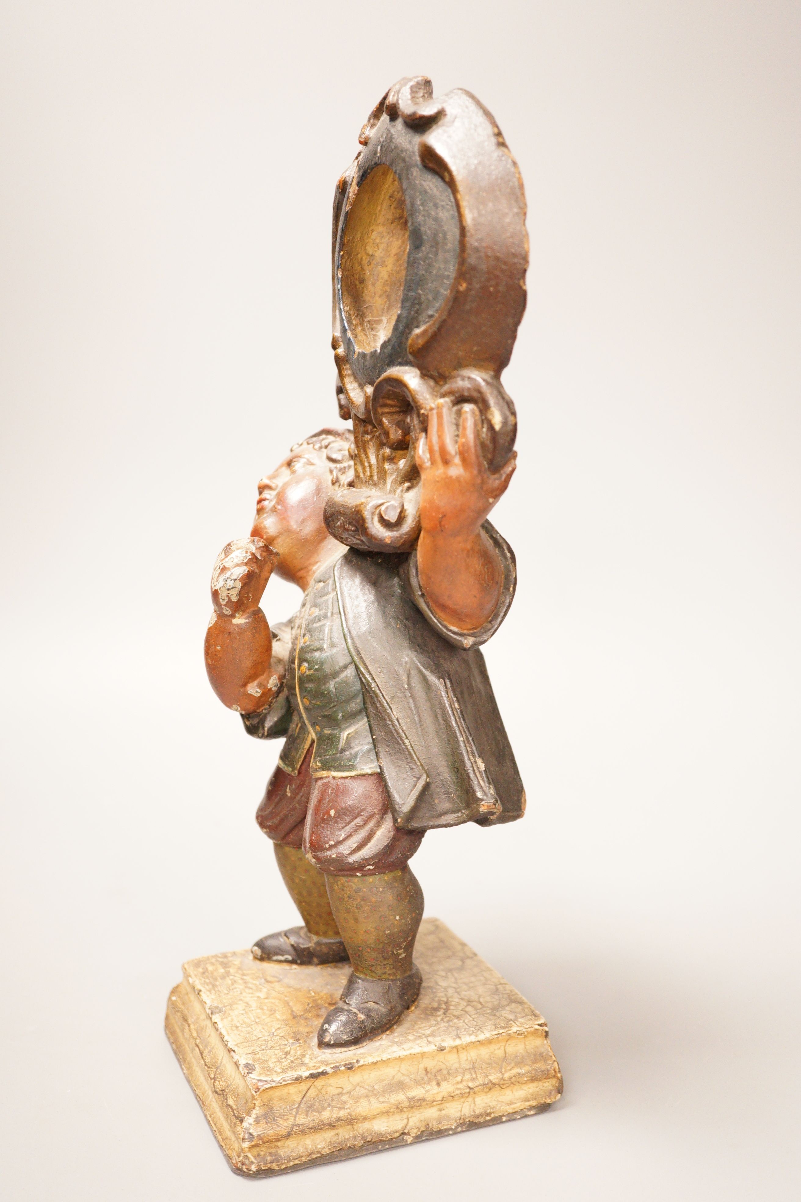 A 19th century French painted wood and composition figural watch stand, 33cm